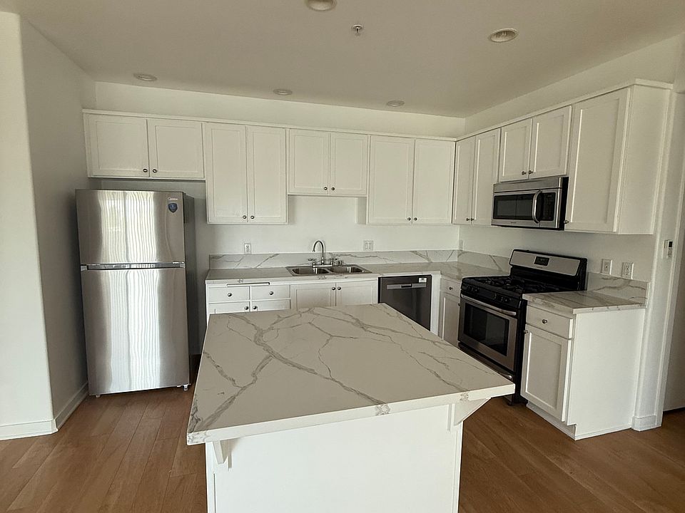 Open concept kitchen area with kitchen island