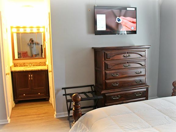 Master Bedroom with TV, Bathroom & Vanity
