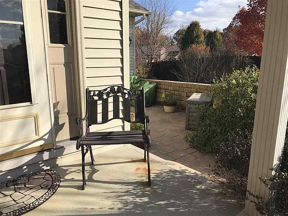 Covered front porch and side walled patio