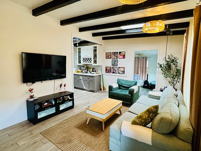 Shared living room (view from entrance to kitchen and bonus room)