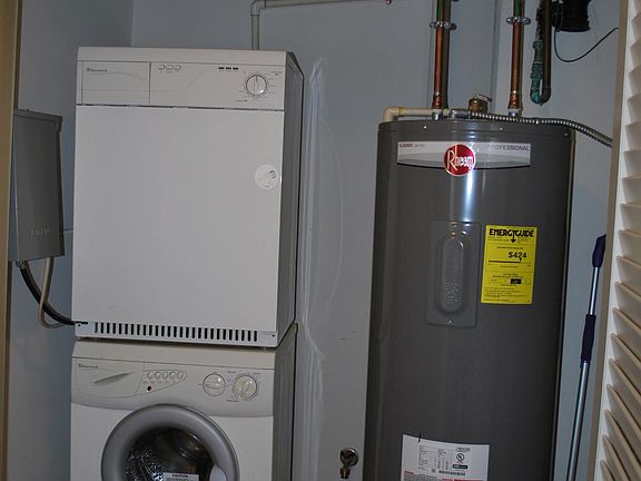Washer/Dryer and Hot Water heater in Utilities closet