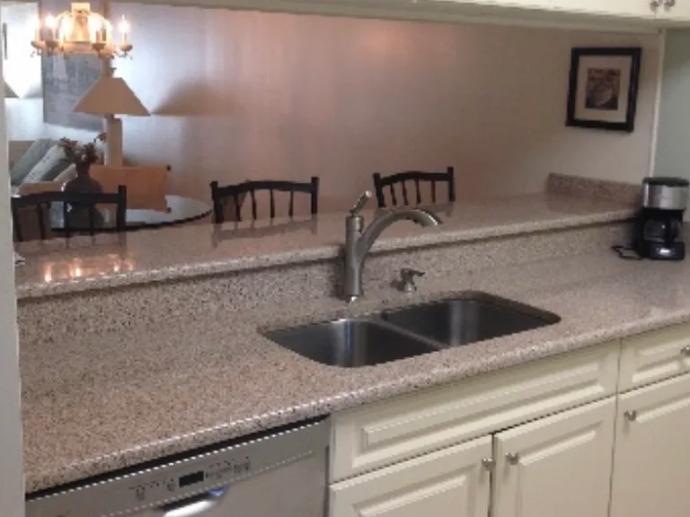 Granite countertops. Fully stocked tableware and cookware.