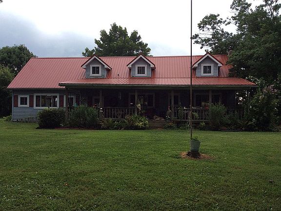 HOME SITS ON 4 ACRES