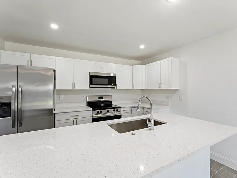 Fully upgraded kitchen with stainless steel appliances and spacious island.