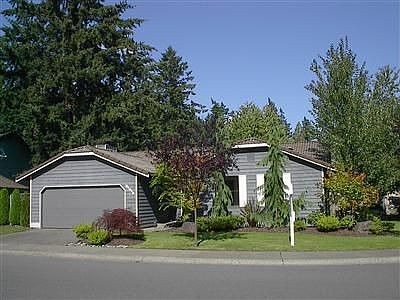 professionally landscaped rambler on corner lot