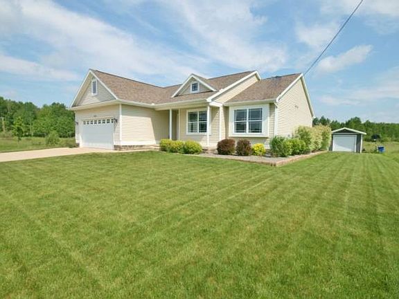 Vinyl siding brings modern durability while stone detailing offers additional beauty to the exterior of the home. Professional landscaping is found surrounding the home with a beautiful lawn to enjoy. 