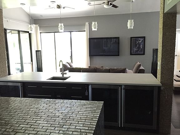 Kitchen View of Wine Fridges & Living Room
