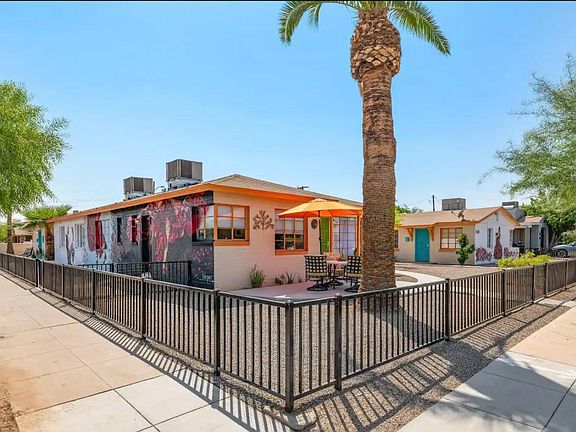 The corner of the complex. 15th street is the street on the Left with bright murals, and Fillmore is on the right. Your building is the far right one with the mural of the dancer in the red dress surrounded by roses. you can see the front door in BLUE