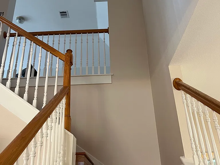 Headed up the stairs to the upstairs hallway and common area/loft - could be used as a second living room, office, or workout room.