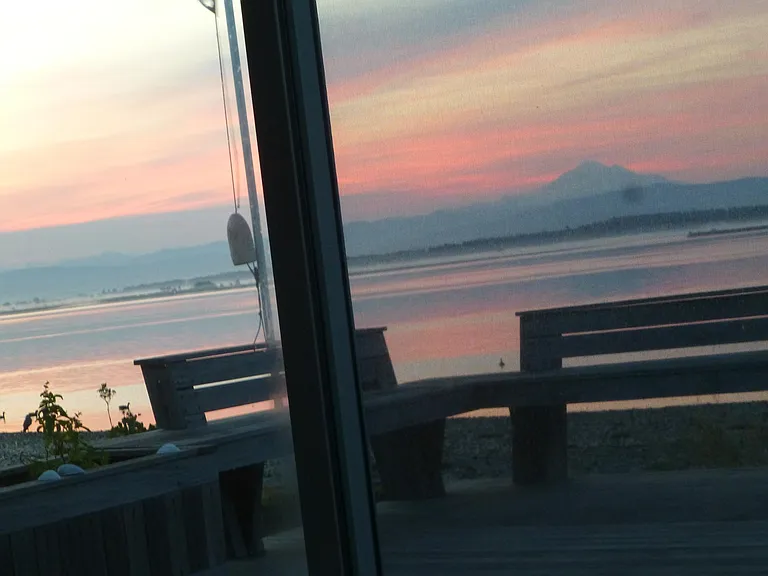 Enjoying the sunrise while lying in bed.