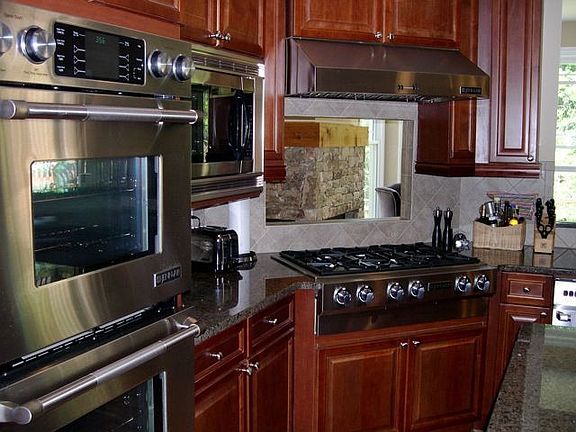 Kitchen with Granite Counters, Cherry Cabinets and Double Ovens