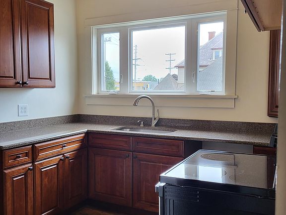Kitchen - quartz countertops and quality Kraftmaid cabinets. Stove and refrigerator with icemaker.