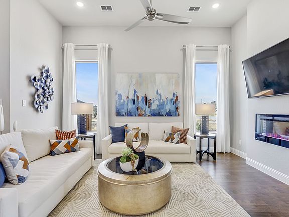 Living room in the Pinot home plan by Trophy Signature Homes - REPRESENTATIVE PHOTO