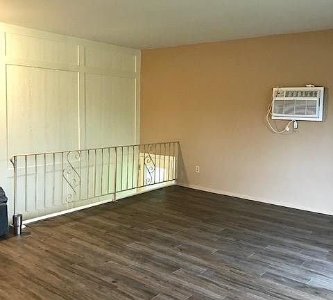 Living Room with Railing for Staircase