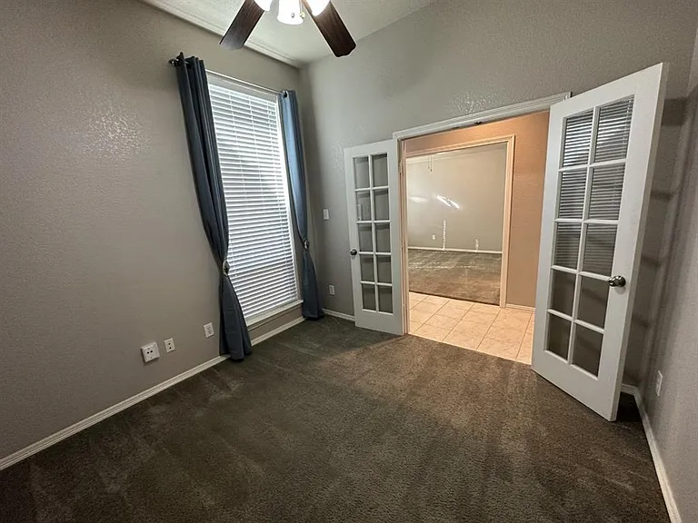 Just off the entry, this room has multiple uses... including as another living area or as a bedroom.