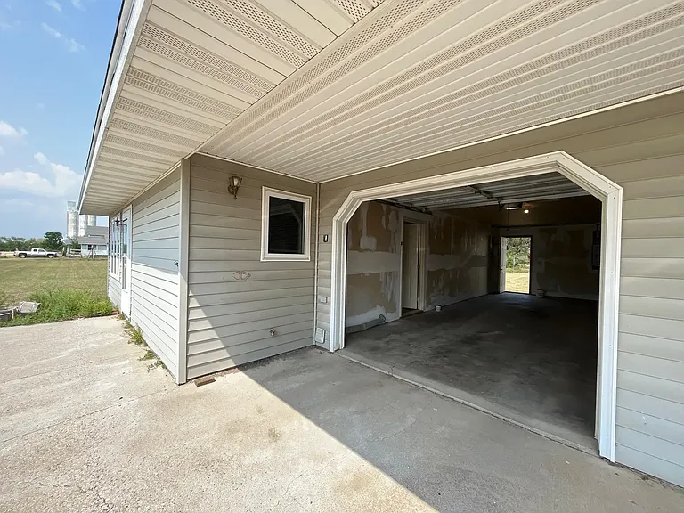 Service Door in rear of garage with yard access