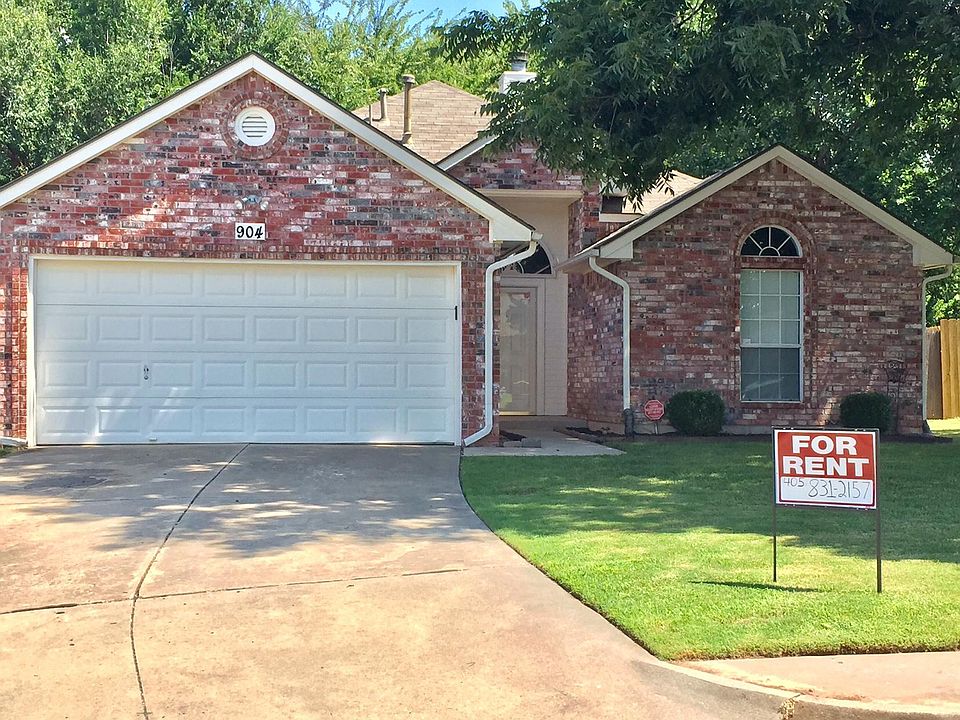 Front of House, 2 car garage with inside area for two cars with opener.