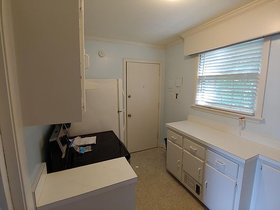 Back door in kitchen provides access to steps to the back yard area.