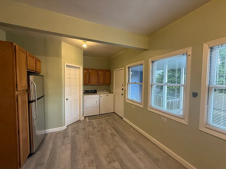 Light-filled kitchen with 20 cu. ft. fridge and full-size side-by-side washer dryer
