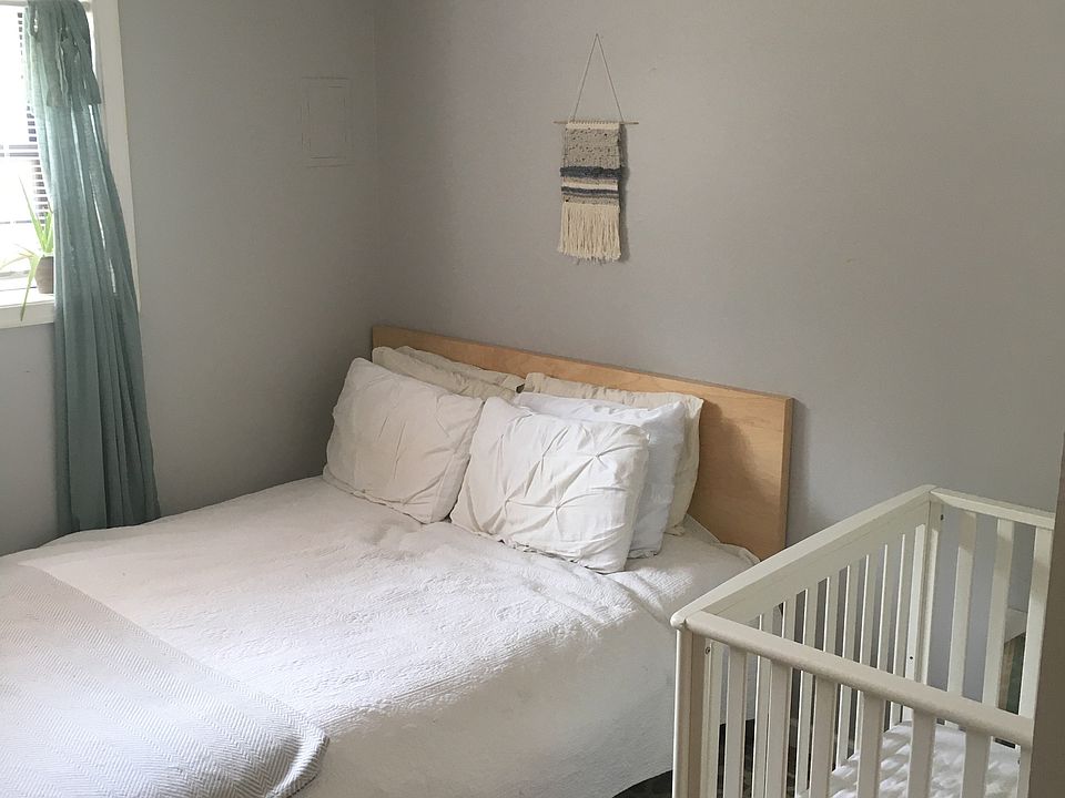 Bedroom is large enough for an infant crib.