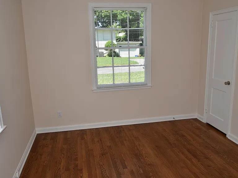 Bedroom. #3: Refinished floors, closet, decorative light
