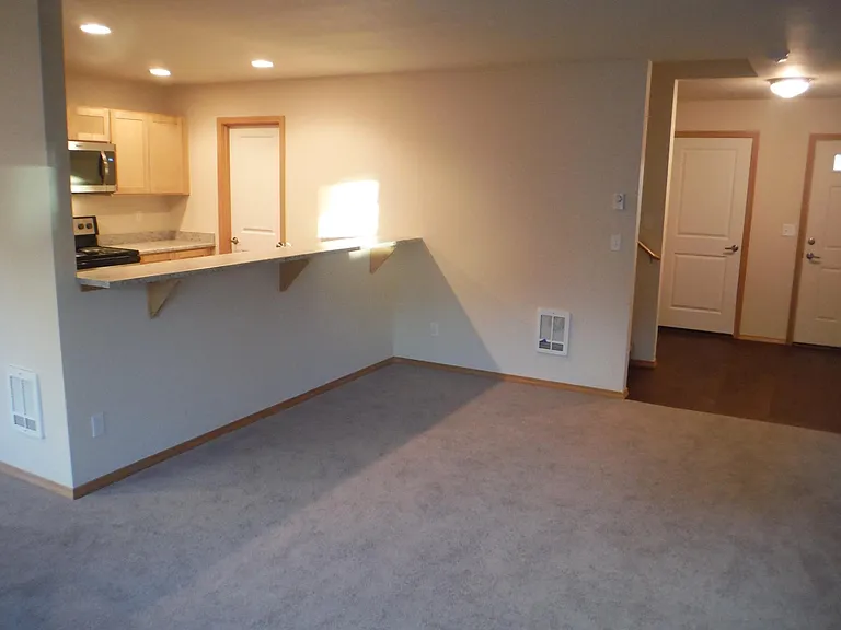 Looking back across living room towards entry