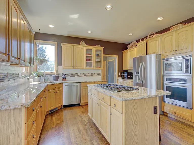 Beautiful granite countertops and an easy flow to the kitchen.