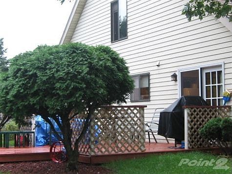 REAR OF HOME WITH NEW DECK