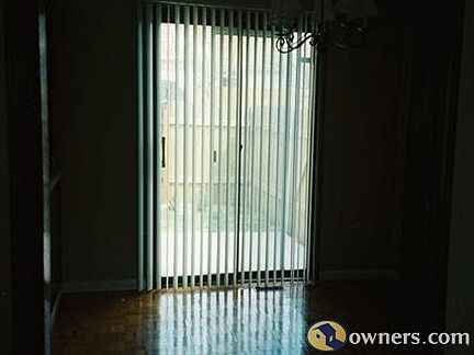 view to fenced patio from dinning room