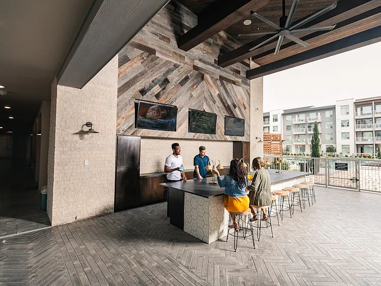 Outdoor lounge with TVs
