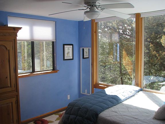 The bedroom with large picture windows