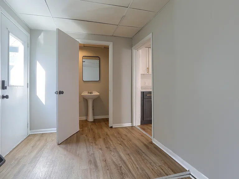 Mudroom, side door and half bathroom