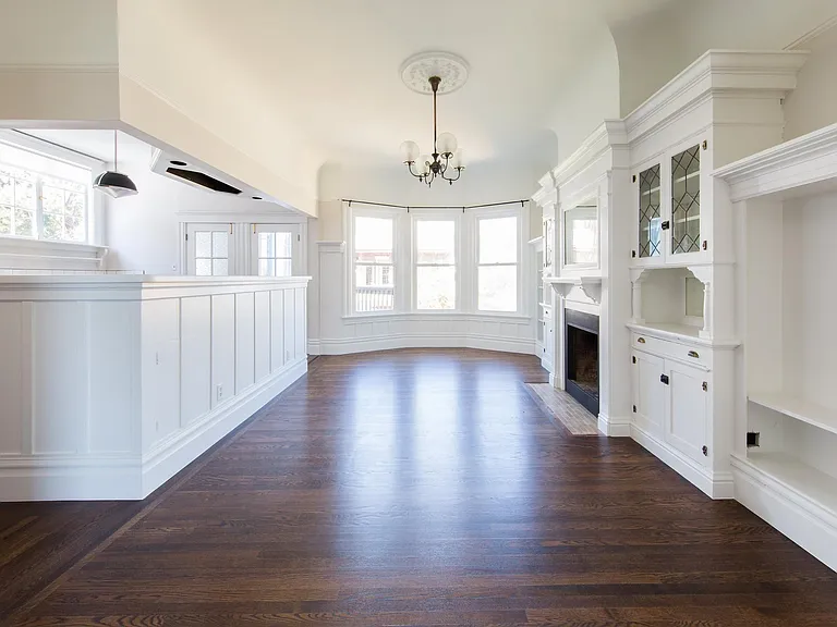 Great room from opposite angle. Deck is accessed by door on right; mudroom (washer/dryer, roof deck) is from door on left. Kitchen is to the left.