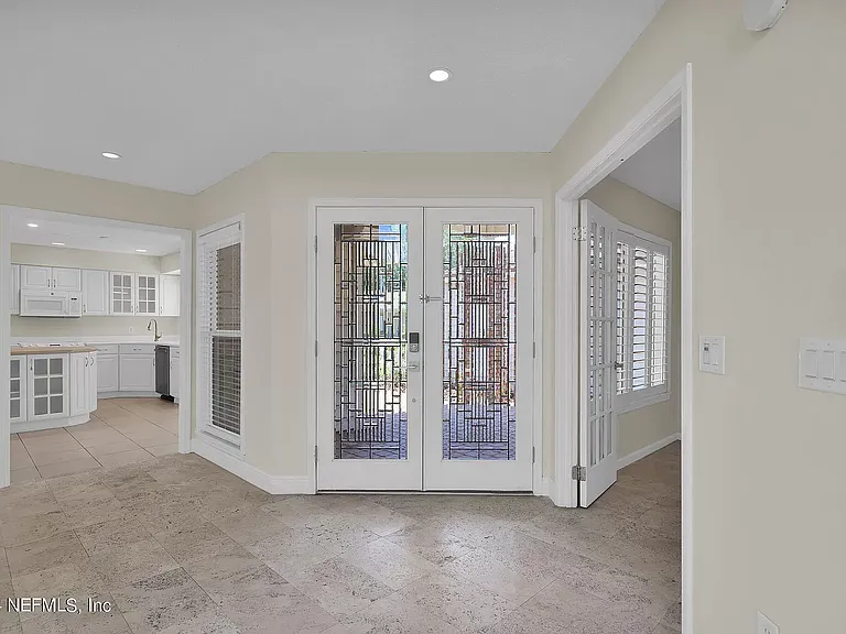 Entrance. Kitchen left, office right.