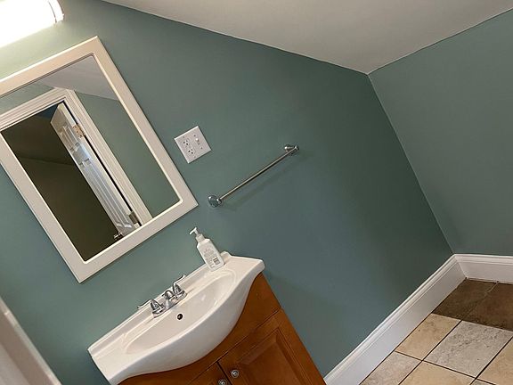 RESTROOM AREA. SINK WITH CABINET