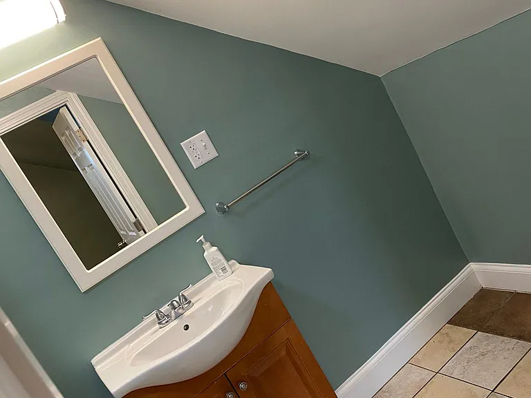 RESTROOM AREA.
SINK WITH CABINET