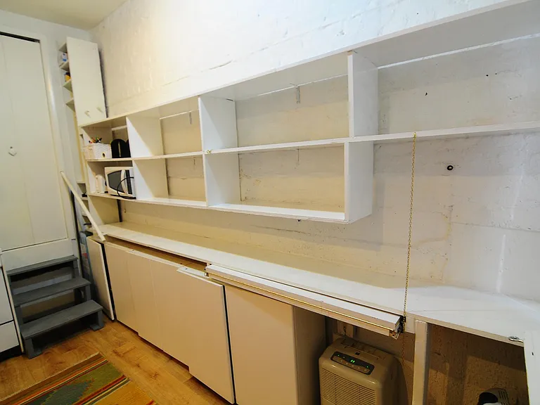 Lots of storage. In addition to closet in front hall, you have generous shelf space and cabinet space below (shown).