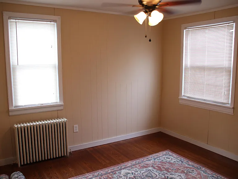 Refinished hardwood flooring, new windows and stylish ceiling fans.