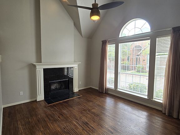 Soaring ceilings and actual handscraped hardwood floors throughout first floor.