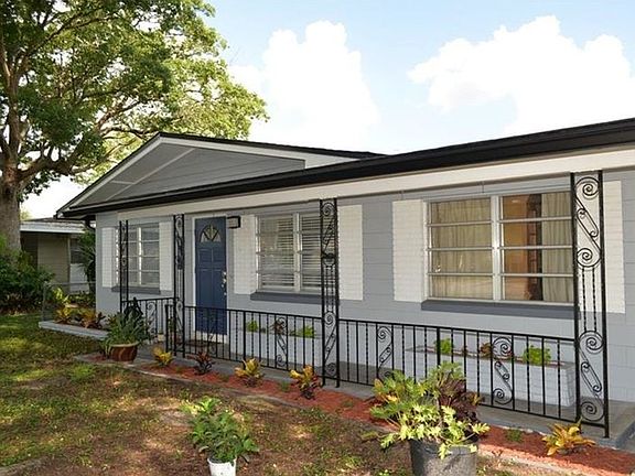 Front yard is shaded by mature trees... windows bring in lot
