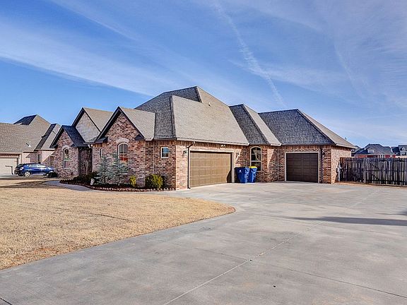 3 car garage & long driveway