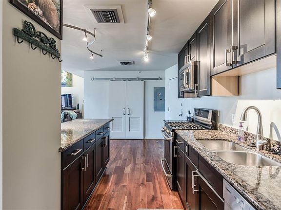 Notice the tract lighting and numerous cabinets and drawers providing plenty of storage!