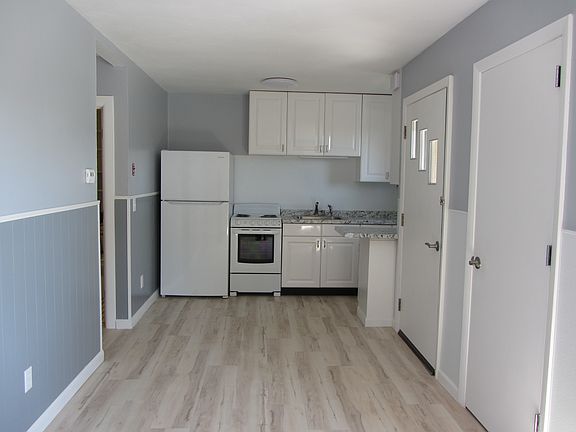 View from living room into dining and kitchen area.