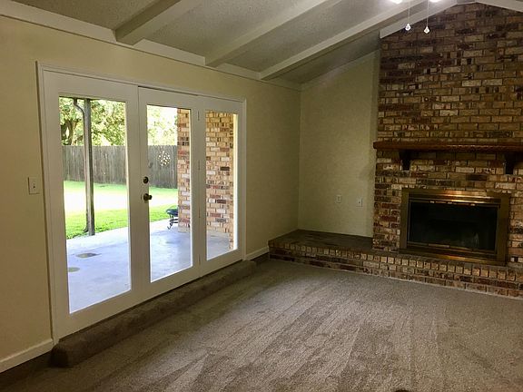 Livingroom which leads to fenced-in back yard.