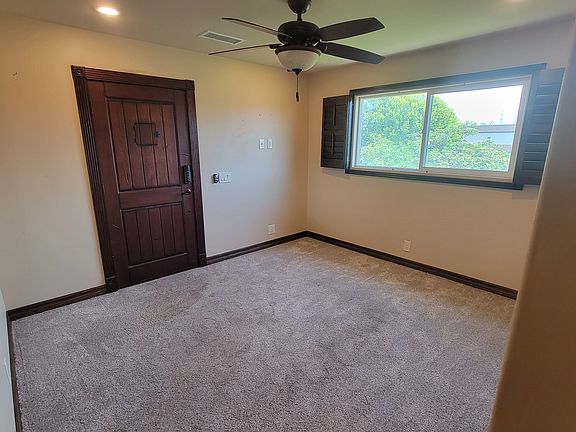 Private entry/living room with front door programmable security lock