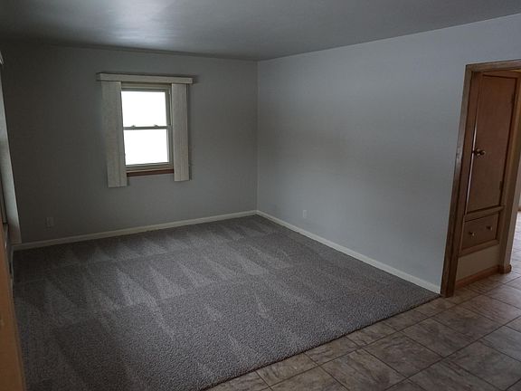 Upstairs living room leads to kitchen.