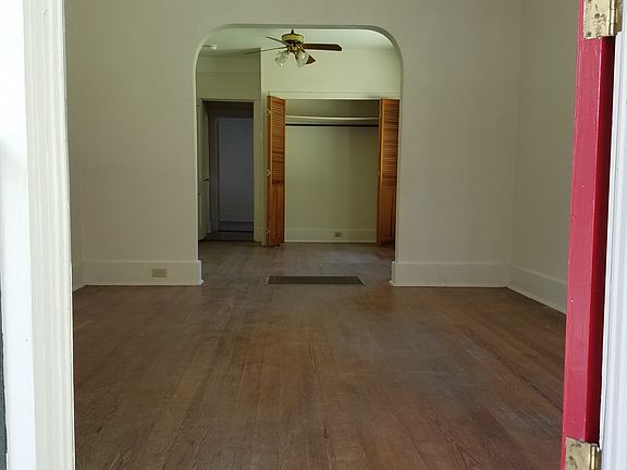 View from door into living room and first bed room
