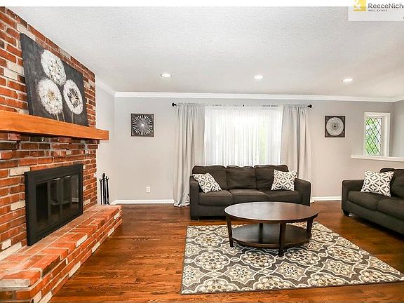 Newly installed recessed lighting and a large windows light up this formal living room.