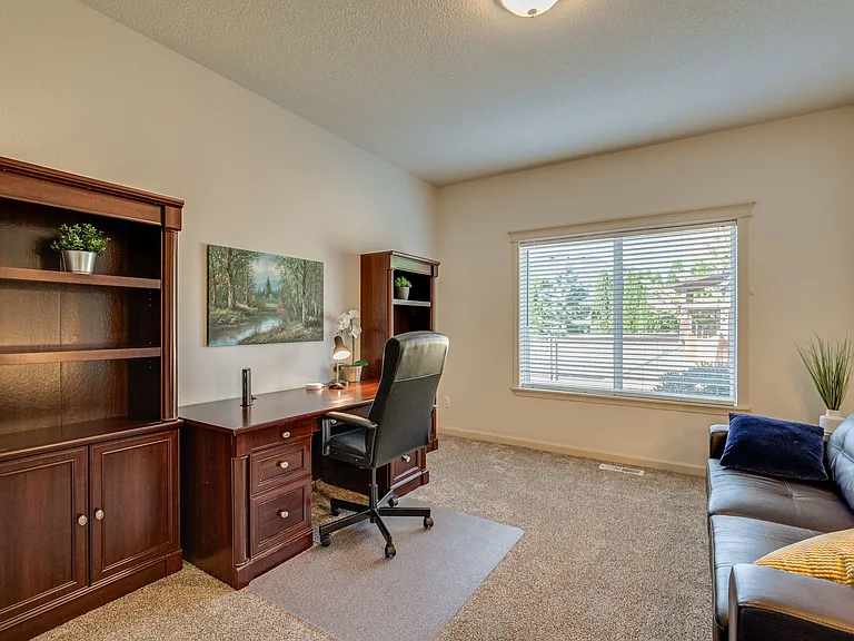 Just off the living room with a large window to the back yard
