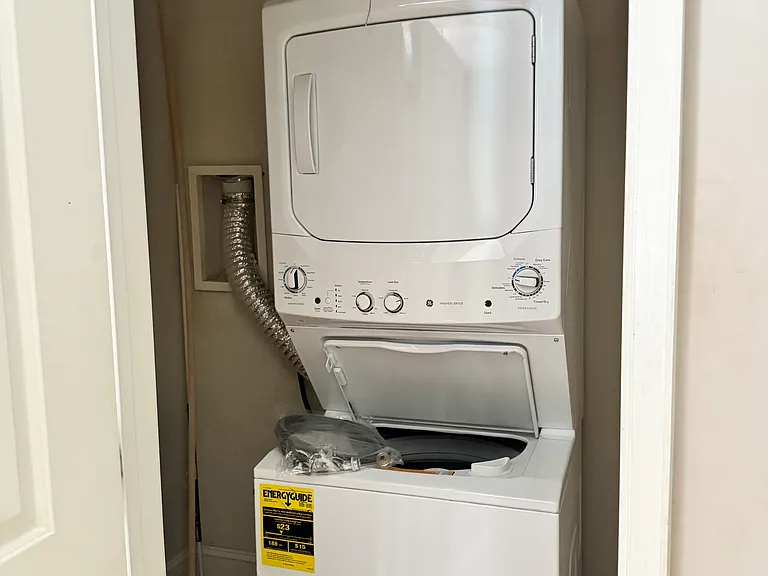 Washer Dryer new in 2024, ample storage space in laundry closet.